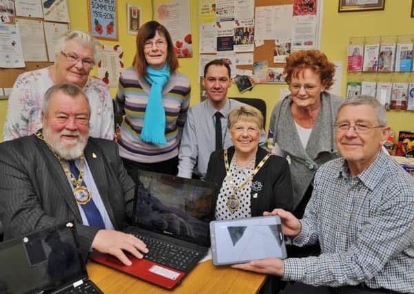 Mayor of Peterborough Coun. John Fox and Mayoress Judy Fox with  PCC digital inclusion officer Matthew Beckett and visitors to the Senior Stop centre learning about IT EMN-180320-163747009