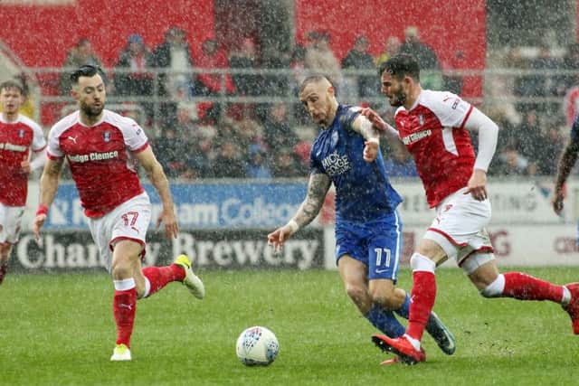 Posh star Marcus Maddison on the attack in the rain at Rotherham. Photo: Joe Dent/theposh.com.