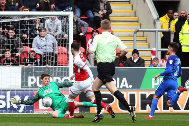 Posh 'keeper Conor O'Malley makes a great early save to thwart Rotherham's Anthony Forde. Photo: Joe Dent/theposh.com.