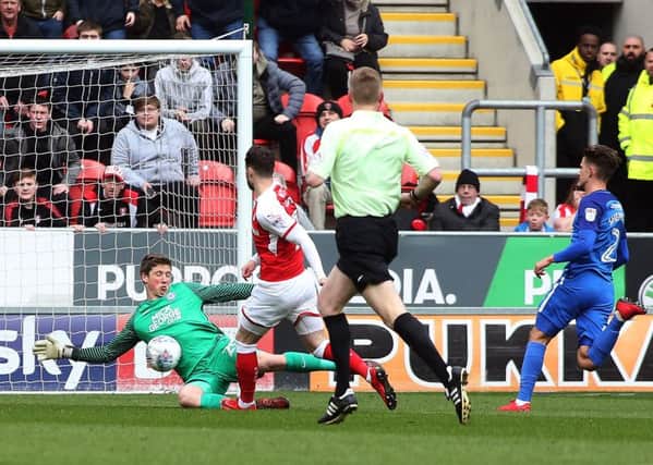 Posh 'keeper Conor O'Malley makes a great early save to thwart Rotherham's Anthony Forde. Photo: Joe Dent/theposh.com.