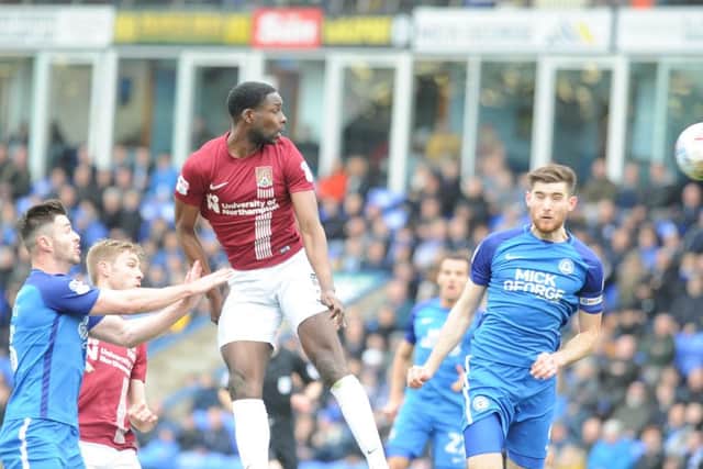 Jack Baldwin (right) scores the first Posh goal against Northampton. Photo: David Lowndes.