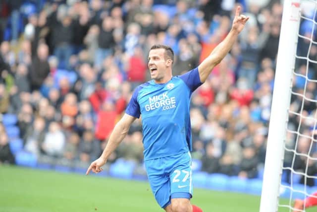 Posh centre-back Steven Taylor is happy after Jack Marriott's goal against Cobblers. Photo: David Lowndes.