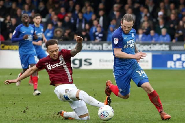 Posh top scorer Jack Marriott skips past Shay facey of Northampton. Photo: Joe Dent/theposh.com.
