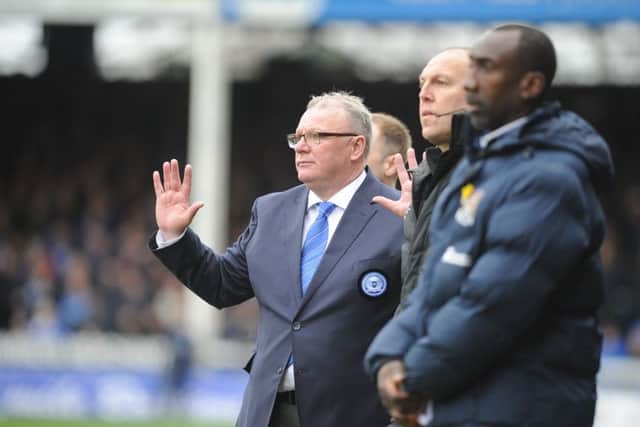 Rival managers Steve Evans and Jimmy Floyd Hasselbaink during the derby at the ABAX Stadium. Photo: David Lowndes.