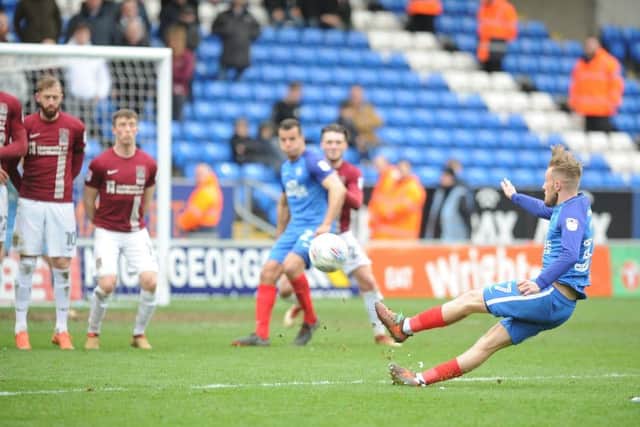 Posh substitute George Cooper slipped as he took this free kick against Northampton. Photo: David Lowndes.