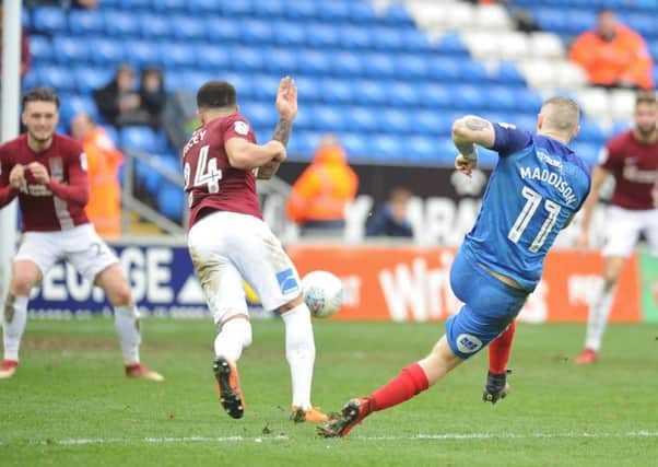 Marcus Maddison in action for Posh.