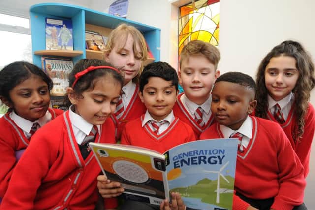Pupils in the library at Sacred Heart RC Primary School which has just attained another Good from OFSTED EMN-180327-155853009