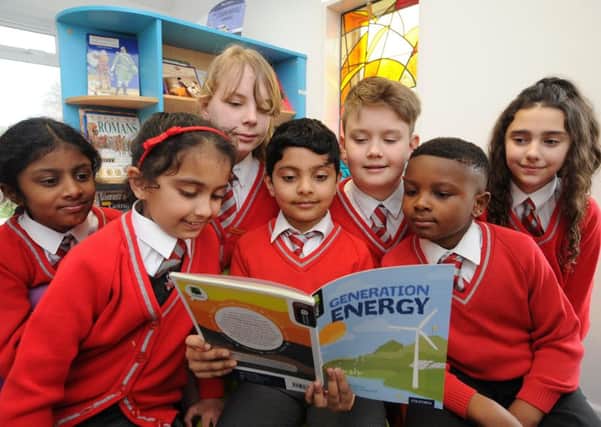 Pupils in the library at Sacred Heart RC Primary School which has just attained another Good from OFSTED EMN-180327-155853009