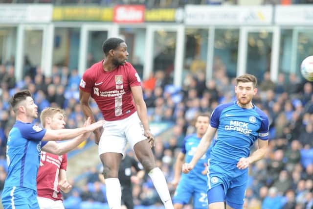 Jack Baldwin (right) scores for Posh against Northampton. Photo: David Lowndes.