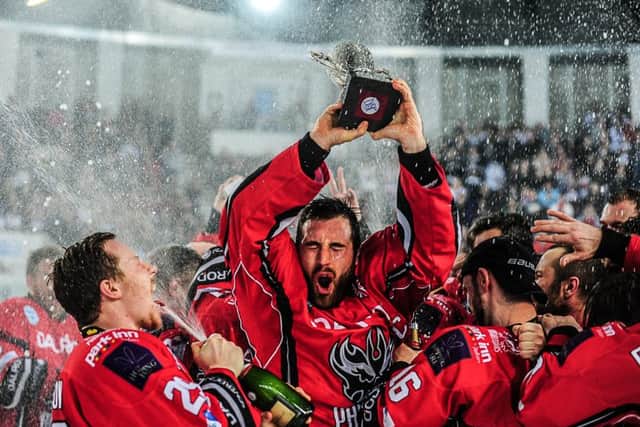 James Ferrara lifts the EPL play-off trophy three years ago.