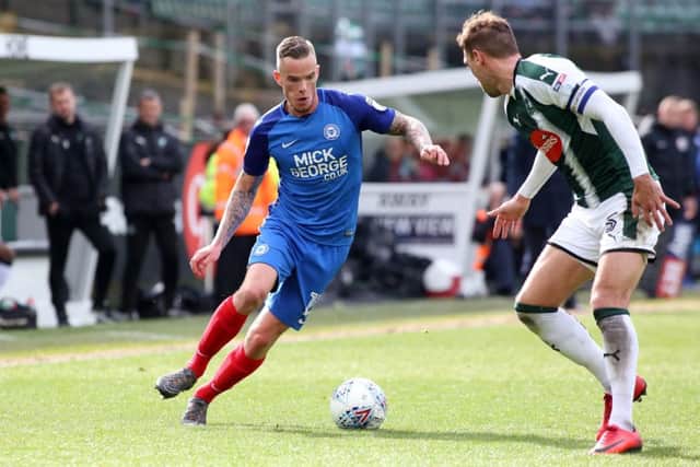 Joe Ward of Peterborough United takes on Gary Sawyer of Plymouth Argyle - Mandatory by-line: Joe Dent/JMP - 07/04/2018 - FOOTBALL - Home Park - Plymouth, England - Plymouth Argyle v Peterborough United - Sky Bet League One