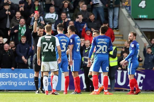 Steven Taylor of Peterborough United is shown a red card by match referee Craig Hicks for a second bookable offence - Mandatory by-line: Joe Dent/JMP - 07/04/2018 - FOOTBALL - Home Park - Plymouth, England - Plymouth Argyle v Peterborough United - Sky Bet League One