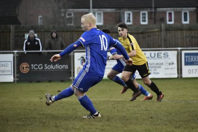 Lewis Hilliard scored the Peterborough Sports winner from the penalty spot.