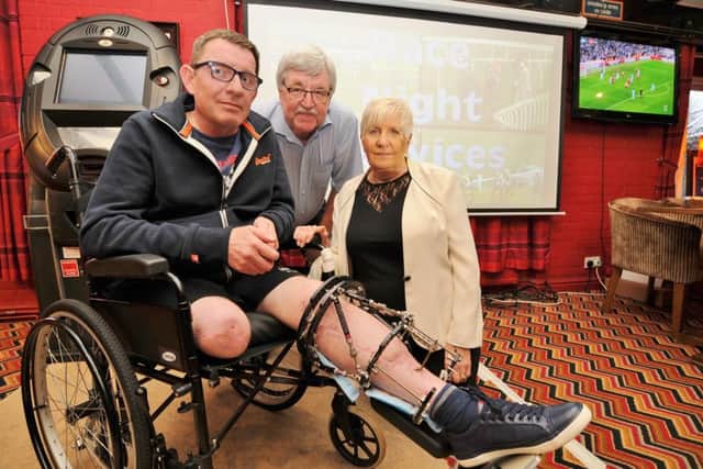 Race night at the Cooper's Pub, South Bretton in aid of MAGPAS. Accident victim (Park Road RTC) Gary Outterside with his mum Sandra Hoyland and step-dad Peter Hoyland EMN-180804-163627009