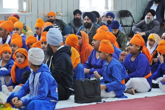 Gurdwara Baba Budha Sahib Sikh Temple . Temple and community members singing and prayers for the Sikh Khalsa Panth celebrations. EMN-180704-170316009