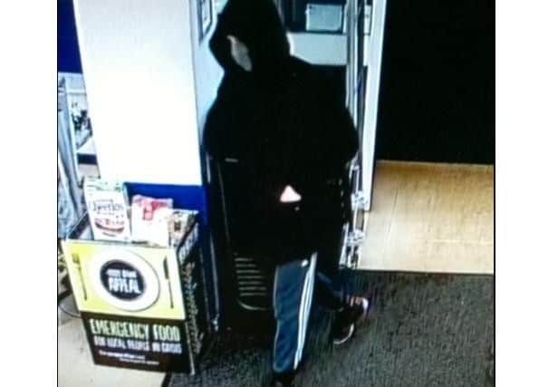 The offender captured on CCTV at the Stanground Co-op store