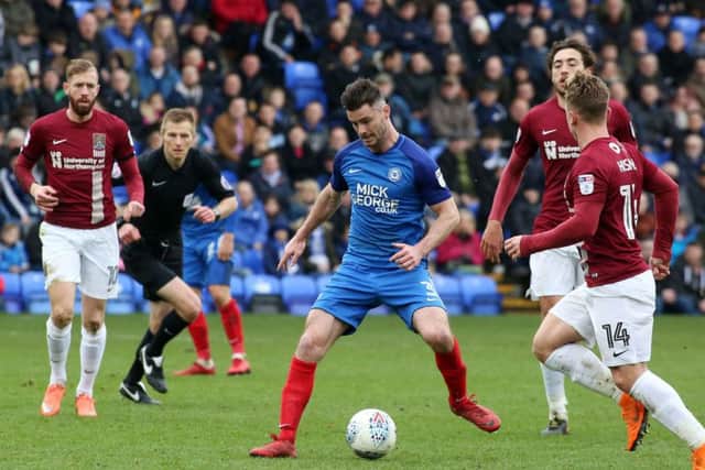 Andrew Hughes might have to play centre-back for Posh against Rochdale.