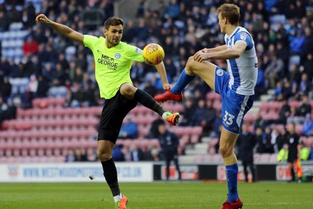 Ryan Tafazolli (left) is a fitness doubt for Posh.