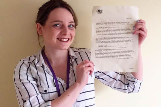 Carly Hain with the Royal Wedding invite she thought was a scam. PHOTO: SWNS