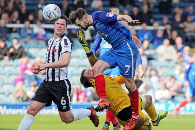 The moment Posh thought they had equalised against Rochdale as Gwion Edwards heads home. Instead he was flagged offside. Photo: Joe Dent/theposh.com.