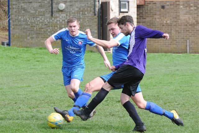 Action from Whittlesey Athletic Reserves' (blue) big win over Rippingale & Folkingham at the Mmanor Leisure Centre. Photo: David Lowndes.