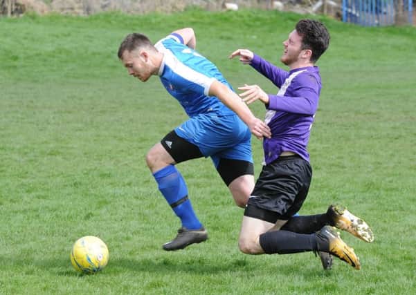Action from Whittlesey Athletic Reserves' (blue) 6-2 win over Riipingale & Folkingham. Photo: David Lowndes.