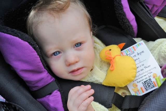 The Little Yellow Ducks Project duck give-away at Central Park. Baby Abigail Foulds EMN-180415-153800009