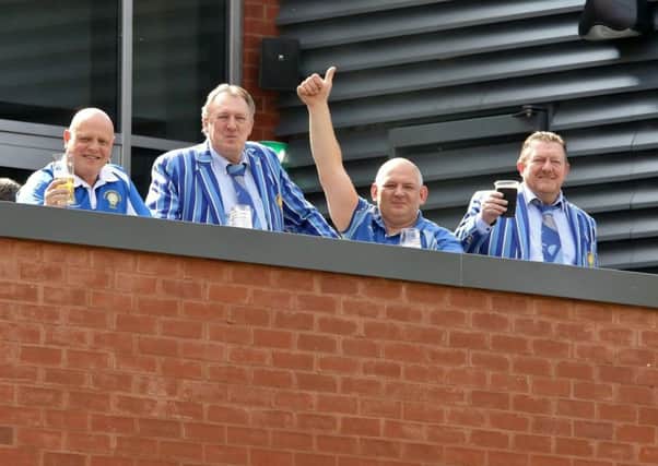 Pictured supporting their team at Bournville are Lions chairman Andy Moore (right) and new club president Mick Royal (second right). Picture: Mick Sutterby