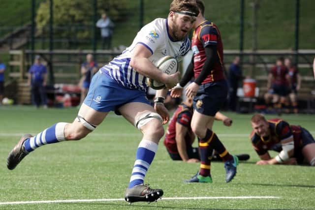 Tom Lewis on the run for the Lions at Bournville. Picture: Mick Sutterby