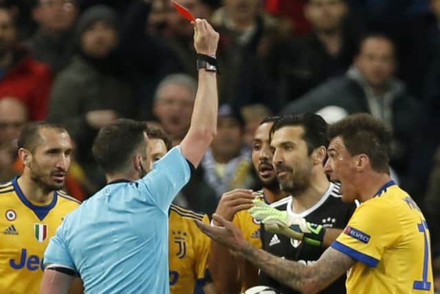 Top-class referee Michael Oliver shows a red card to the obnxious Gianluigi Buffoon.