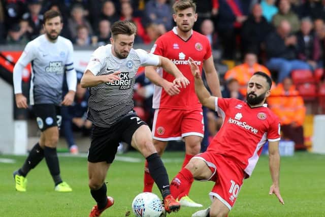 Former Posh player Erhun Oztumer (right) has been selected for the PFA League One team of the year.