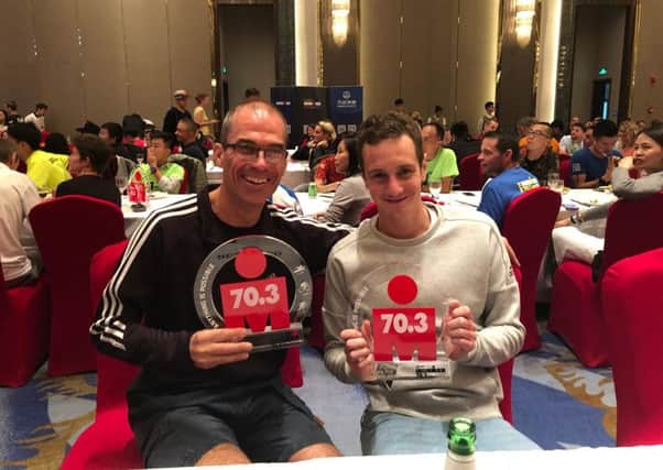 Best of British . . . Roger Canham (left) with Alistair Brownlee in China.