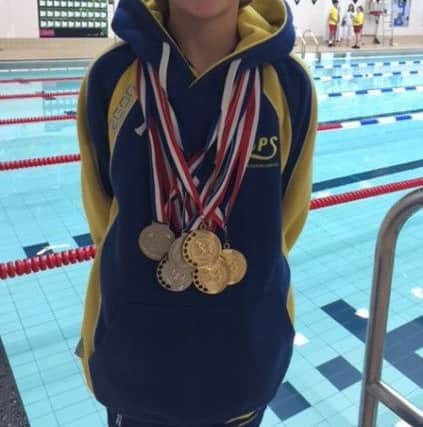 Lilly Davis won stacks of medals.