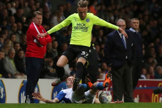 Posh midfielder George Cooper in action at Blackburn. Photo: Joe Dent/theposh.com.