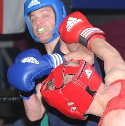 Dale Melville (red) stopped  Steve Sandsbury.