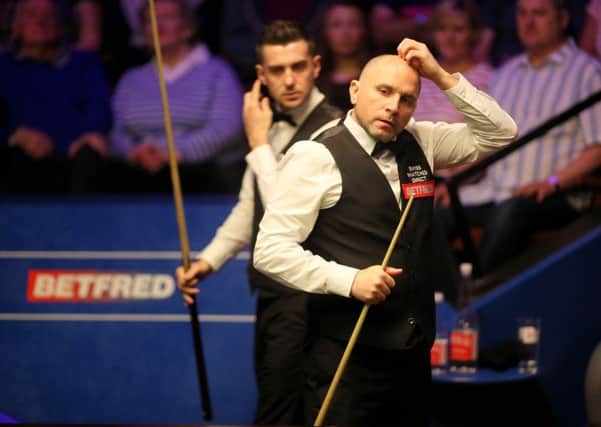 Joe Perry and Mark Selby during their World Championship battle.