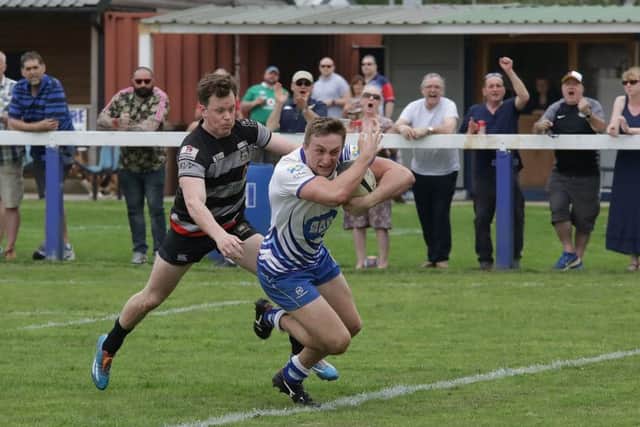 Tom Gulland races in for a Lions try. Picture: Mick Sutterby