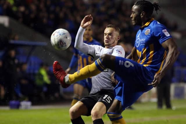 Posh forward Joe ward battles with Shrewsbury's Omar Beckles. Photo: Joe Dent/theposh.com.