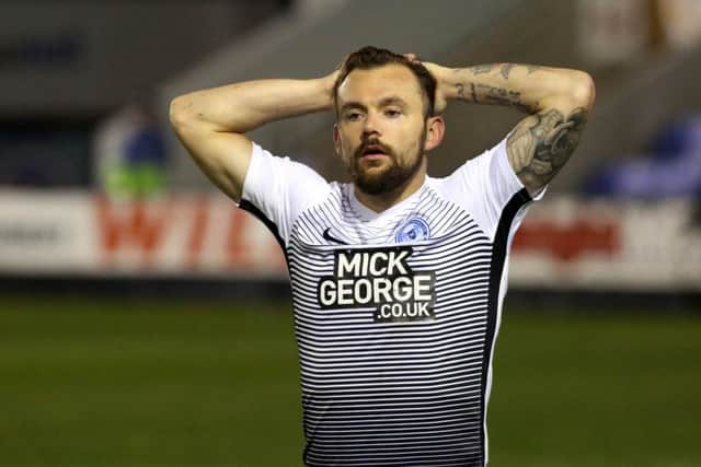 Posh striker Danny Lloyd is dejected at full-time at Shrewsbury. Photo: Joe Dent/theposh.com.