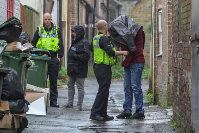 Police raid the premises in Wisbech. Photo: Terry Harris