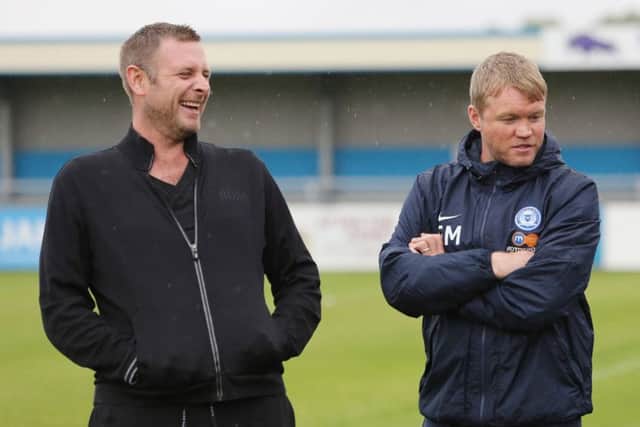 Posh chairman Darragh MacAnthony (left) with former manager Grant McCann.