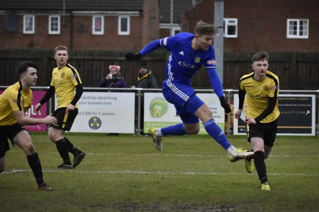 Mark Jones (blue) has been an ever-present for Peterborough Sports in their Evo Stik League campaign.