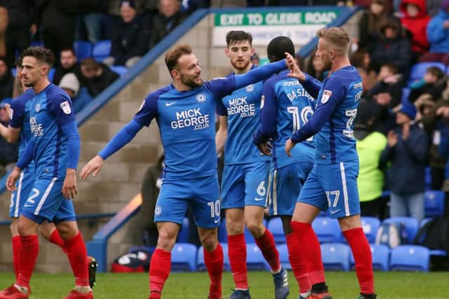Danny Lloyd (left) congratulates George Cooper on his goal for Posh against Fleetwood. Photo: Joe Dent/theposh.com.