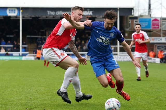 Posh midfielder Gwion Edwards takes on Fleetwood's Ashley Eastham. Photo: Joe Dent/theposh.com.