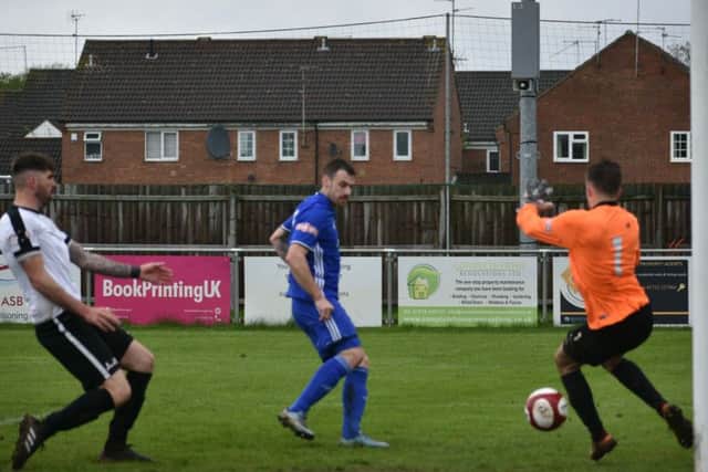Josh Moreman opens the scoring for Peterborough Sports against Corby. Photo: James Richardson.