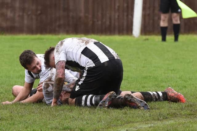 Jake Sansby (middle) of Peterborough Northern Star celebrates with team-mates after scoring against Kirby Muxloe. Photo: Chantelle McDonald. @cmcdphotos.