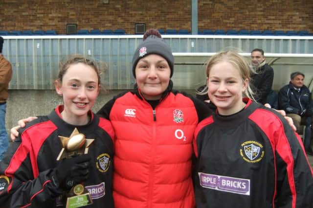 Holley Ross (left) and Borough Under 13 girls captain Liberty Ashdown (right) with England international Amy Cockayne.