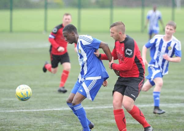 Action from Netherton United's 11-0 win over Peterborough Sports Reserves (blue). Photo: David Lowndes.