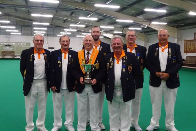 The winning Eversley Trophy team was, from the left, Les Sharp, Malcolm Squires, Tony Mace (county president with trophy), Neil Wright, Richard Montgomery, Graham Agger and Cliff Watson.