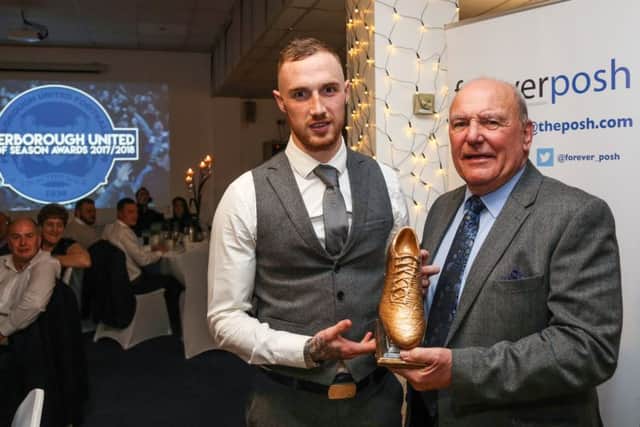 Marcus Maddison collects his prize for Posh goal of the season from club legend Tommy Robson. Photo: Joe Dent/theposh.com.